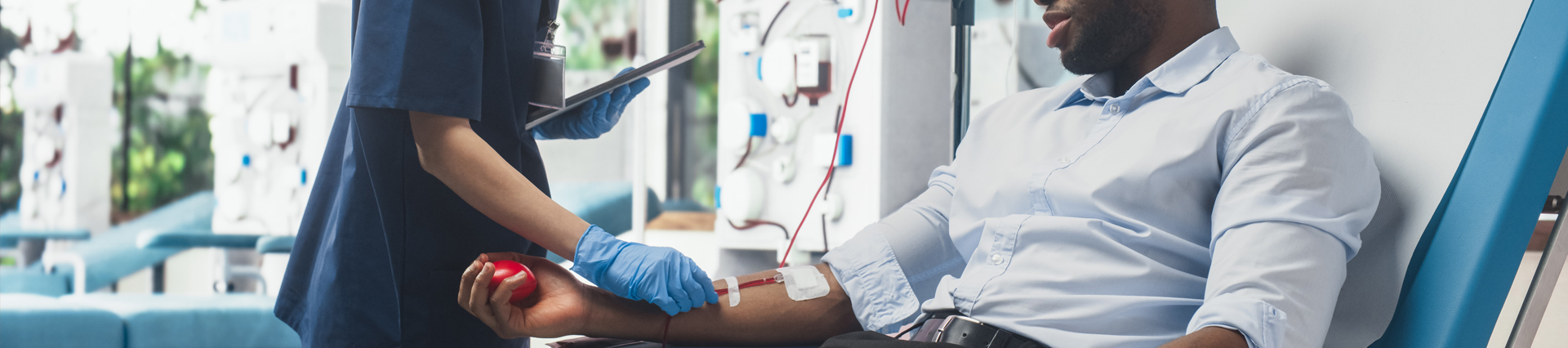 Person having their blood drawn at a blood draw station