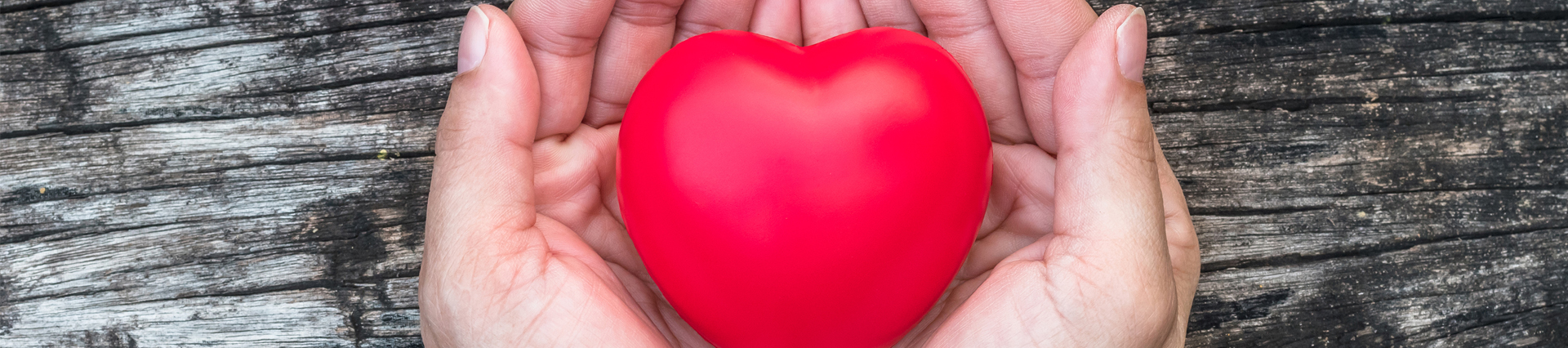 Hands holding a red heart